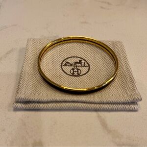 NEW NEVER WORN Hermes Black and Gold Bangle